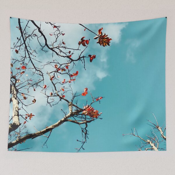 Item preview, Tree branch with orange autumn leaves and blue sky background designed and sold by Mrvell.