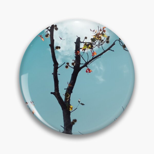 Item preview, Tree branch and orange autumn leaves with blue sky background designed and sold by Mrvell.