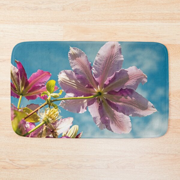 Item preview, A rose pink towering Clematis against a blue sky.  designed and sold by Cameranick.