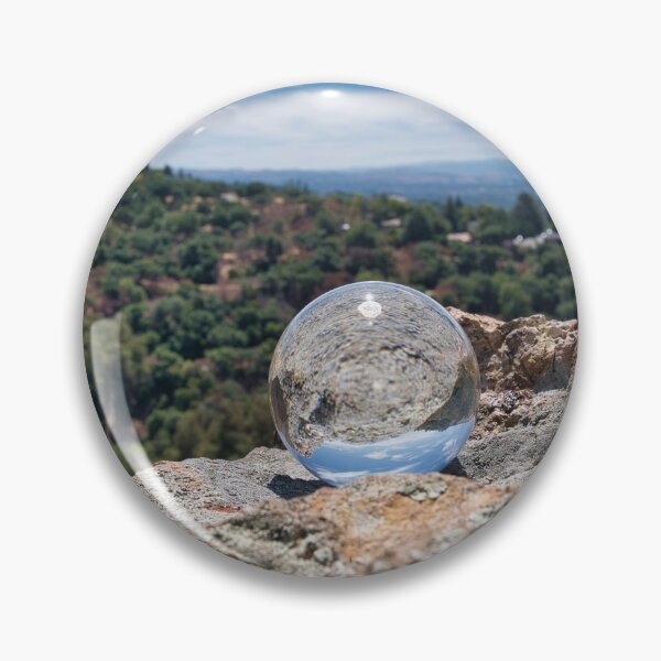 Item preview, Reflection Of A Rock Forest And A Sky Landscape Through A Crystal Ball designed and sold by edwinvisuals.