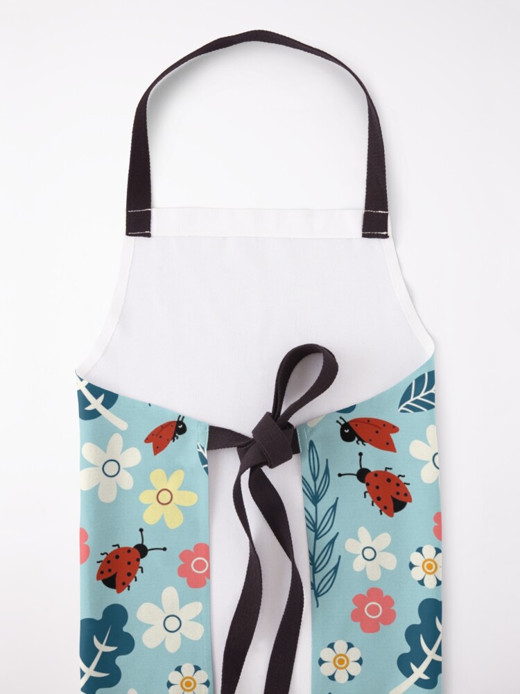 Alternate view of Spring meadow in bloom with ladybirds on blue background Apron