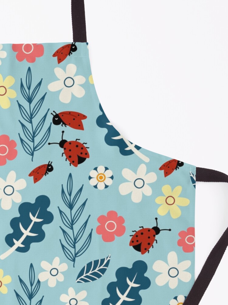 Alternate view of Spring meadow in bloom with ladybirds on blue background Apron