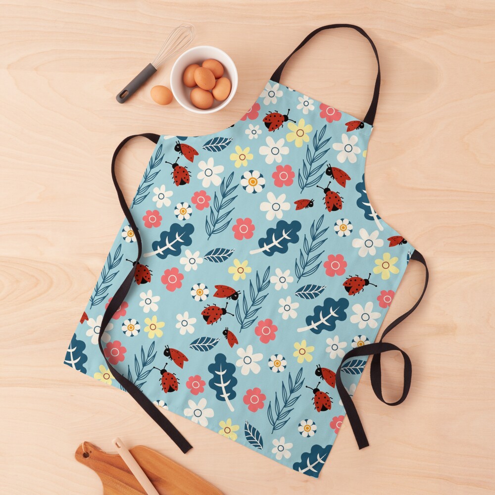 Spring meadow in bloom with ladybirds on blue background Apron