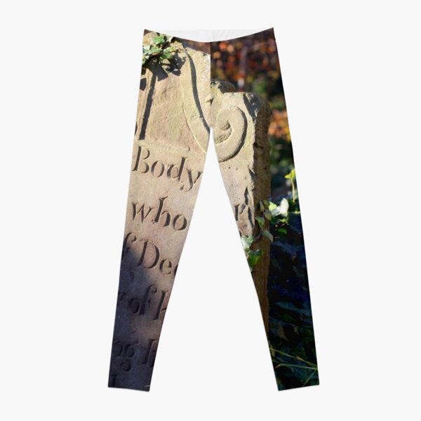 17th century gravestone in autumn light Leggings