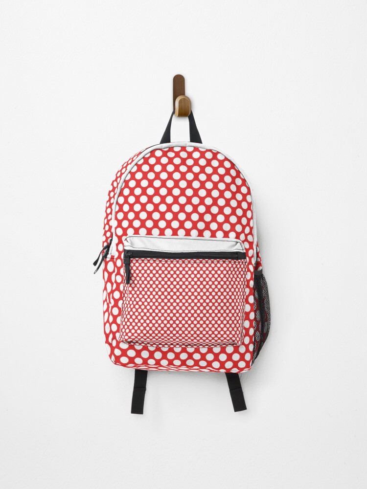 red and white polka dot backpack