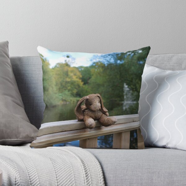 Little bear soft toy sitting on the fence Throw Pillow