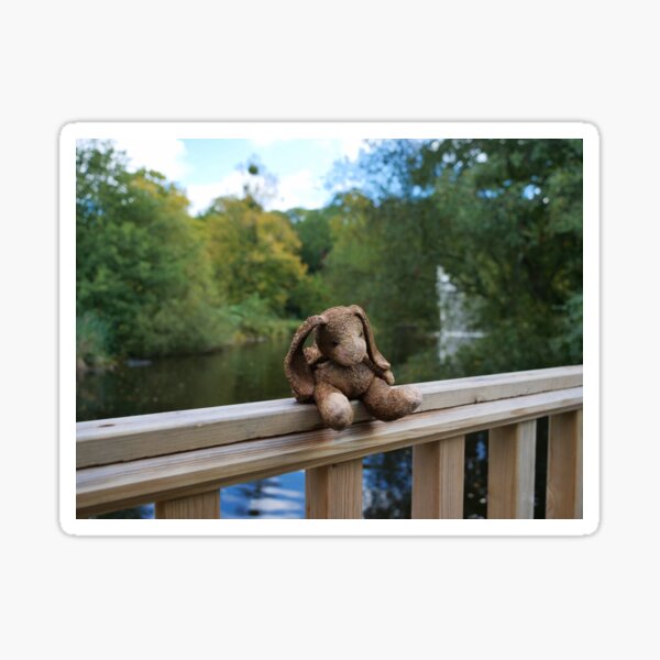 Little bear soft toy sitting on the fence Sticker
