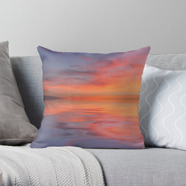 Setting sun and reflections in the water Throw Pillow