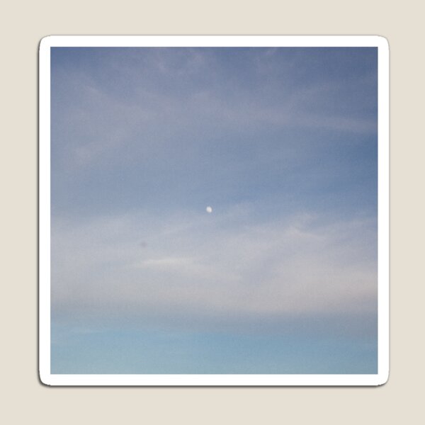 Faded Moon in blue clear sky Magnet
