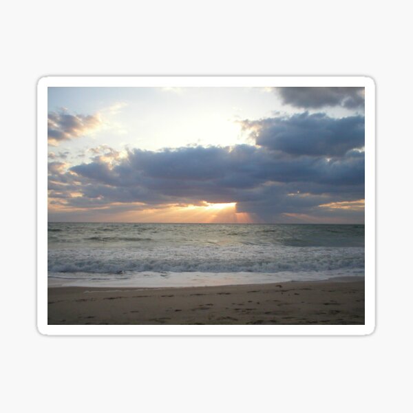 Sunrise shining like sparkling gold on the ocean in Florida Sticker
