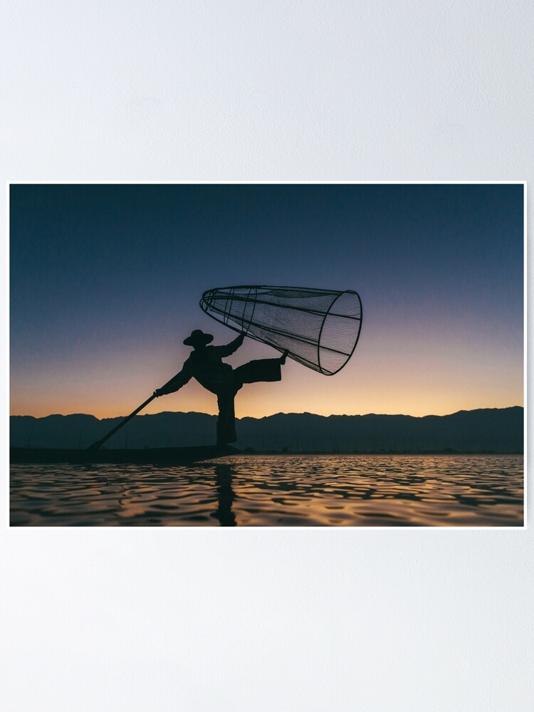 Silhouette of traditional fisherman throwing net fishing lake at Stock  Photo