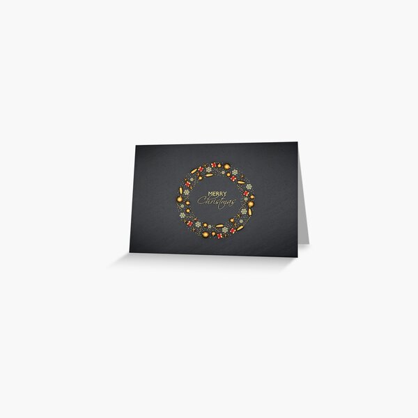 A circle of flat lay golden christmas ornaments on a black stone plate. Text "Merry Christmas" inside. Greeting Card