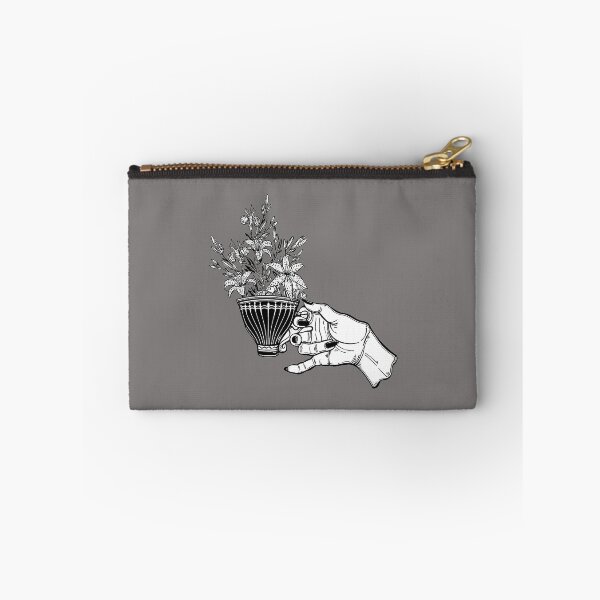 Item preview, Hand holding a magic tea or coffee cup with lily flowers designed and sold by ExocetMerch.