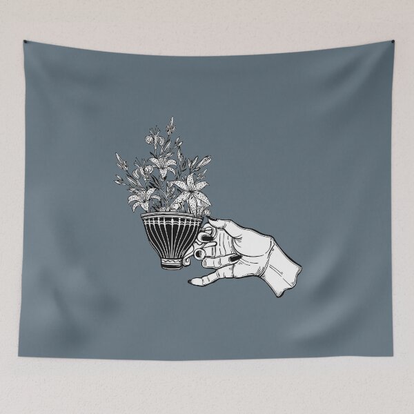 Item preview, Hand holding a magic tea or coffee cup with lily flowers designed and sold by ExocetMerch.