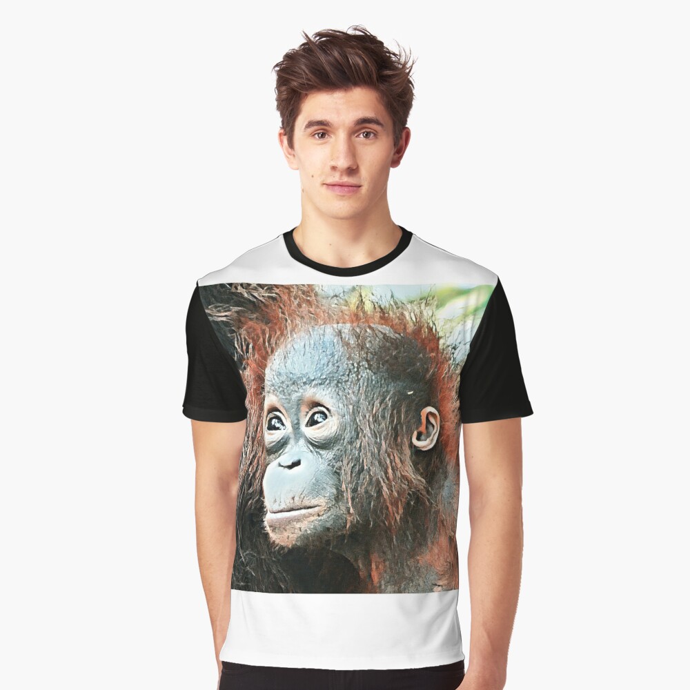Baby orangutan living in Tanjung Puting National Park Graphic T-Shirt