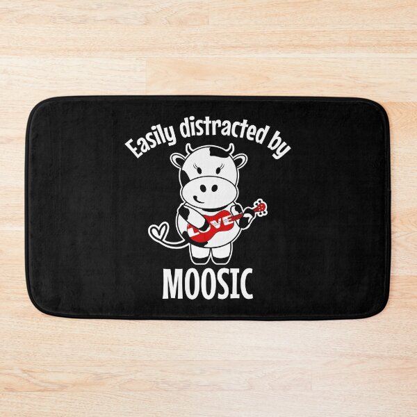 Item preview, Easily distracted by moosic | Cute cow playing the ukulele designed and sold by DeliriousSteve.