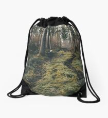 Boy walking through mystic forest landscape photography Drawstring Bag