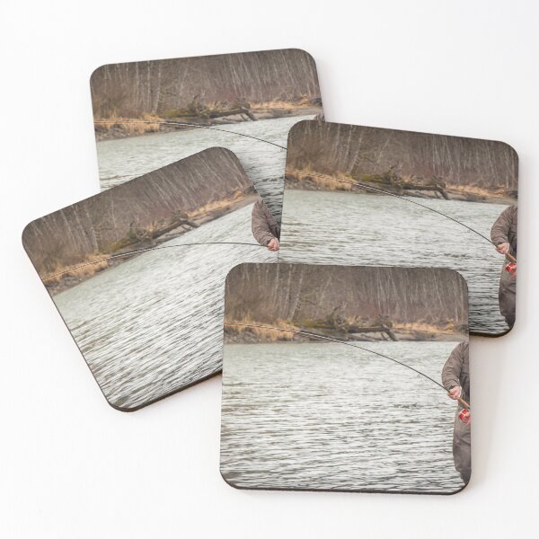 Item preview, A fly fisherman hooked into a big fish in a river with the rod bent designed and sold by SnapTPhotograph.