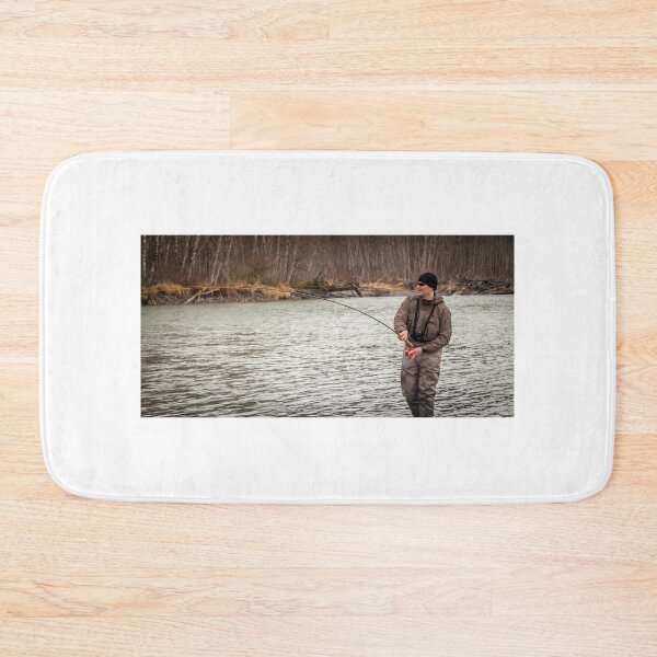 Item preview, A fly fisherman hooked into a big fish in a river with the rod bent designed and sold by SnapTPhotograph.