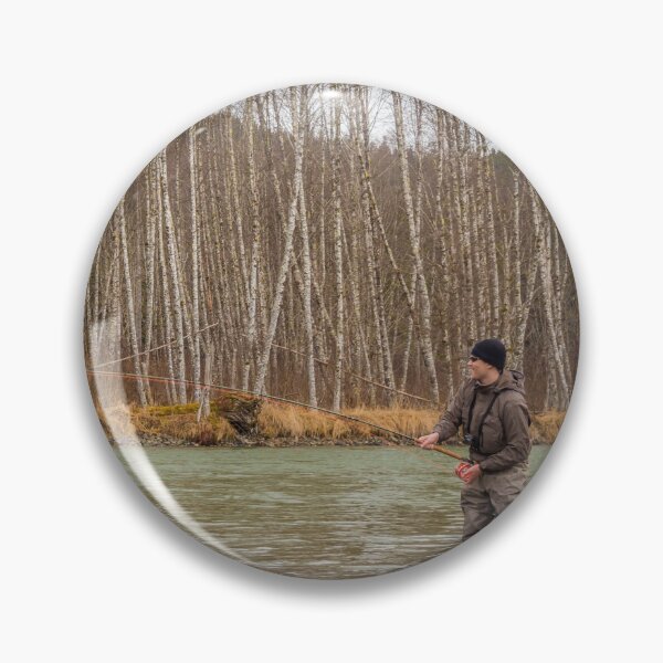 Item preview, A fly fisherman hooked into a big fish in a river with the rod bent designed and sold by SnapTPhotograph.