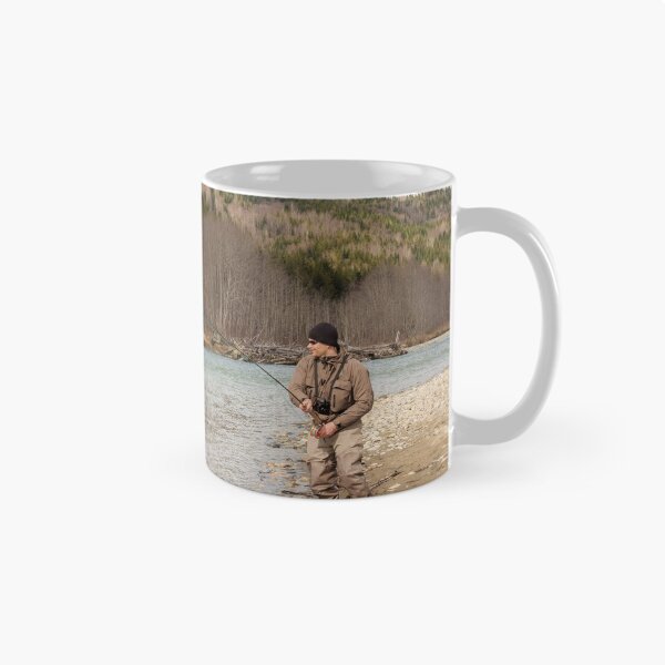 Item preview, A fly fisherman hooked into a big fish in a river with the rod bent designed and sold by SnapTPhotograph.