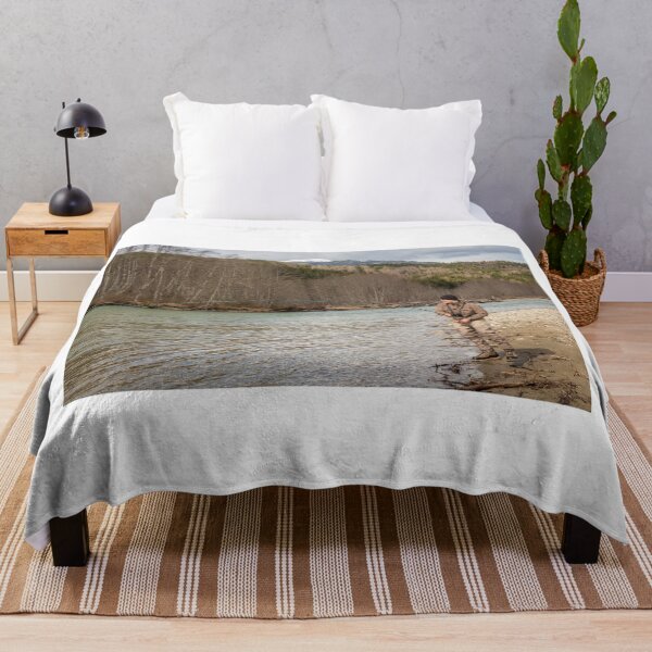 Item preview, A fly fisherman hooked into a big fish in a river with the rod bent designed and sold by SnapTPhotograph.
