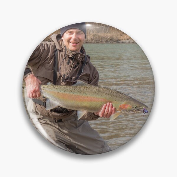 Item preview,  A fly fisherman holding a big steelhead in the spring sun. designed and sold by SnapTPhotograph.