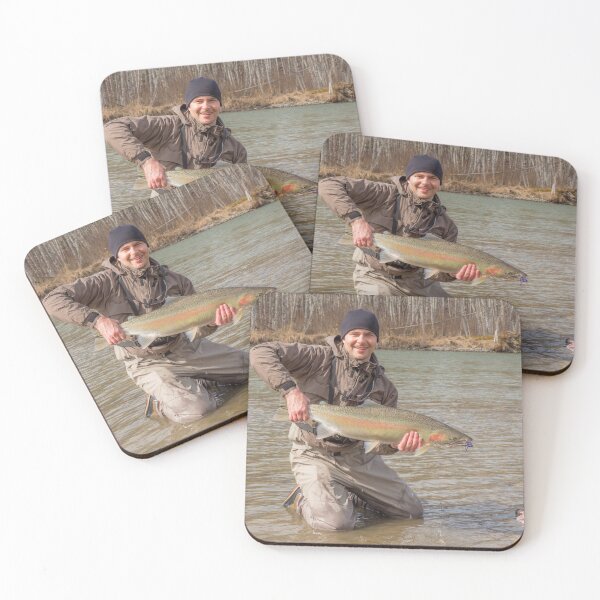 Item preview,  A fly fisherman holding a big steelhead in the spring sun. designed and sold by SnapTPhotograph.