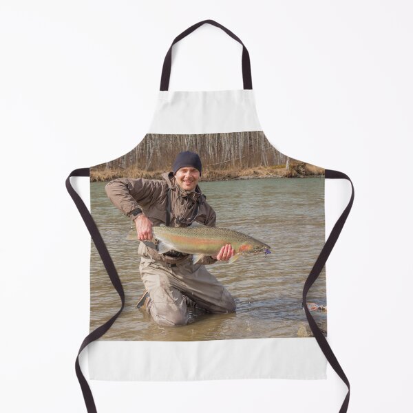 Item preview, A fly fisherman holding a big steelhead in the spring sun. designed and sold by SnapTPhotograph.