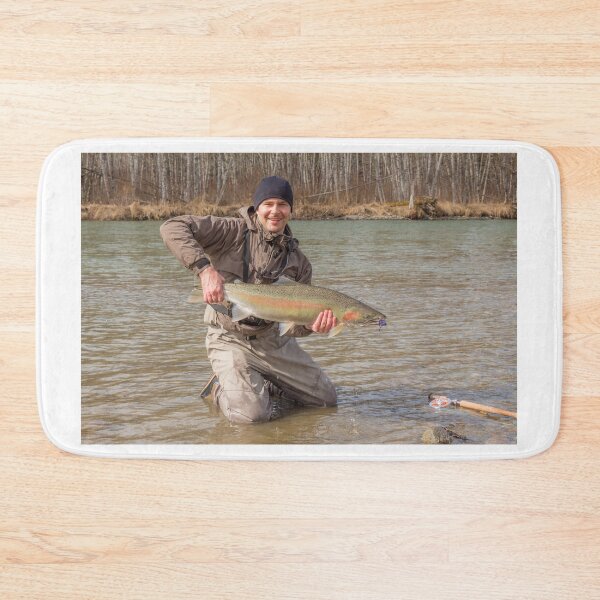Item preview,  A fly fisherman holding a big steelhead in the spring sun. designed and sold by SnapTPhotograph.