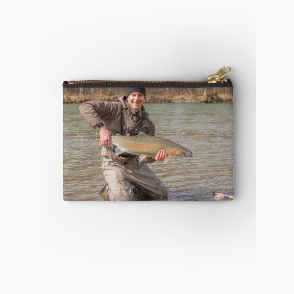 Item preview,  A fly fisherman holding a big steelhead in the spring sun. designed and sold by SnapTPhotograph.