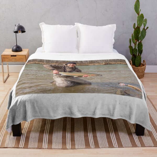 Item preview,  A fly fisherman holding a big steelhead in the spring sun. designed and sold by SnapTPhotograph.