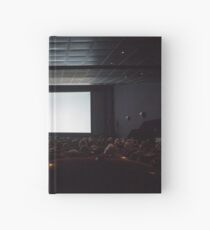 Empty cinema screen with audience. Hardcover Journal