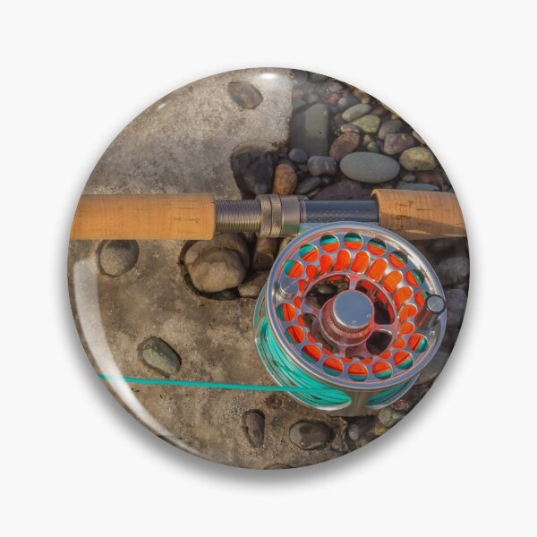 Item preview, Salmon spey fly rod and reel resting on gravel and snow designed and sold by SnapTPhotograph.