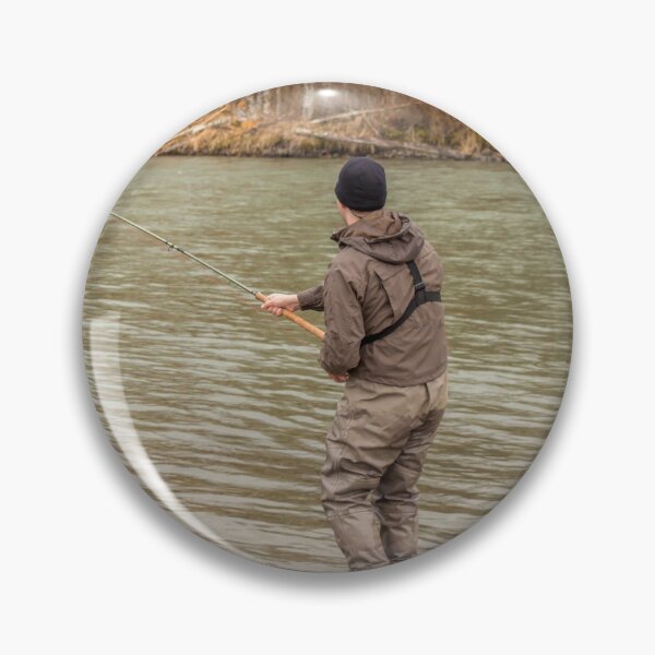 Item preview, A fly fisherman hooked into a big fish in a river with the rod bent designed and sold by SnapTPhotograph.