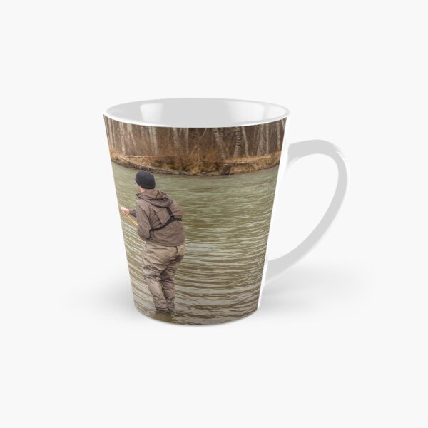 Item preview, A fly fisherman hooked into a big fish in a river with the rod bent designed and sold by SnapTPhotograph.