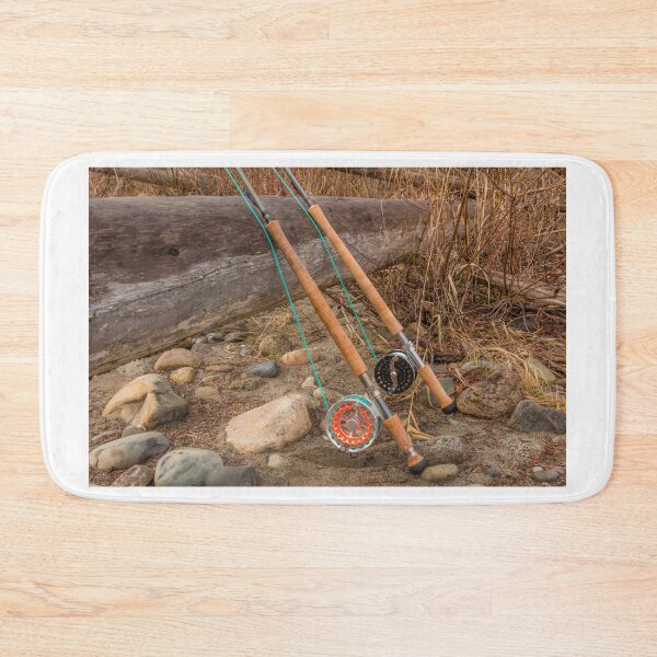 Item preview, Two salmon spey fly rods resting on a log in the late afternoon sun designed and sold by SnapTPhotograph.