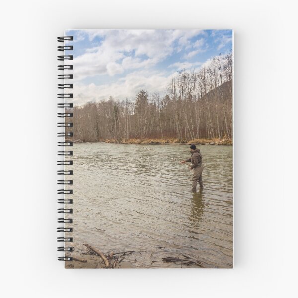 Item preview, A fisherman with a big fish on the line in a spring river in Canada designed and sold by SnapTPhotograph.