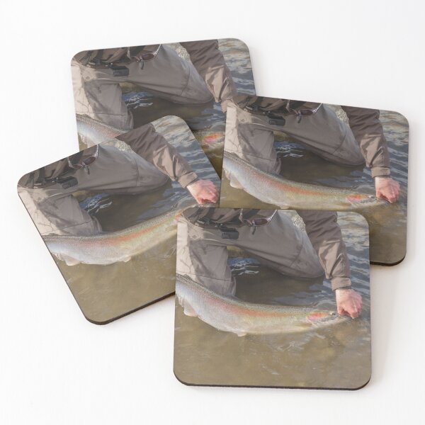 Item preview, An angler unhooking a fly from a steelhead in the morning spring sun designed and sold by SnapTPhotograph.