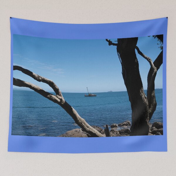 Item preview, View through twisted pohutukawa tree branches across barge with crane blue ocean to distant horizon designed and sold by Brian Scantlebury.