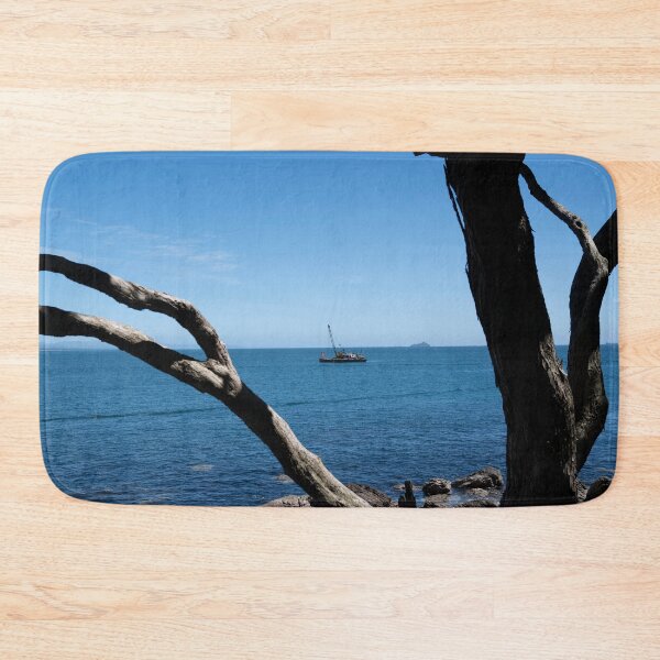 Item preview, View through twisted pohutukawa tree branches across barge with crane blue ocean to distant horizon designed and sold by Brian Scantlebury.