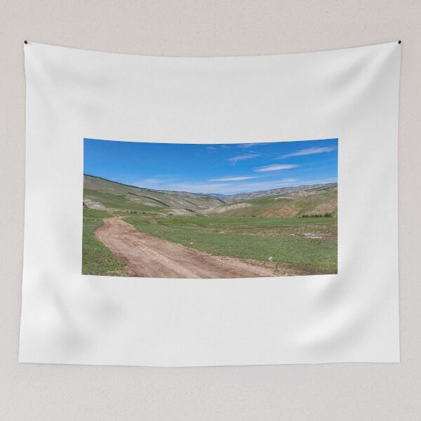 Item preview, Dirt track leading up a Mongolian grassland valley on a summer day designed and sold by SnapTPhotograph.