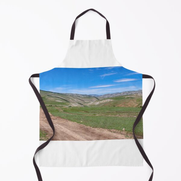 Item preview, Dirt track leading up a Mongolian grassland valley on a summer day designed and sold by SnapTPhotograph.