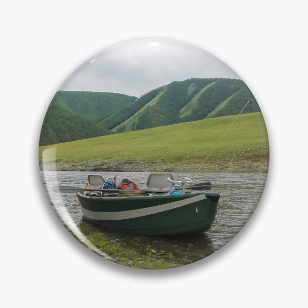 Item preview, A fishing raft and kayak anchored on grass bank beside the river designed and sold by SnapTPhotograph.