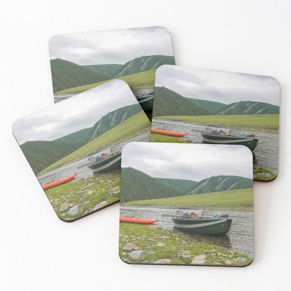Item preview, A fishing raft and kayak anchored on grass bank beside the river designed and sold by SnapTPhotograph.