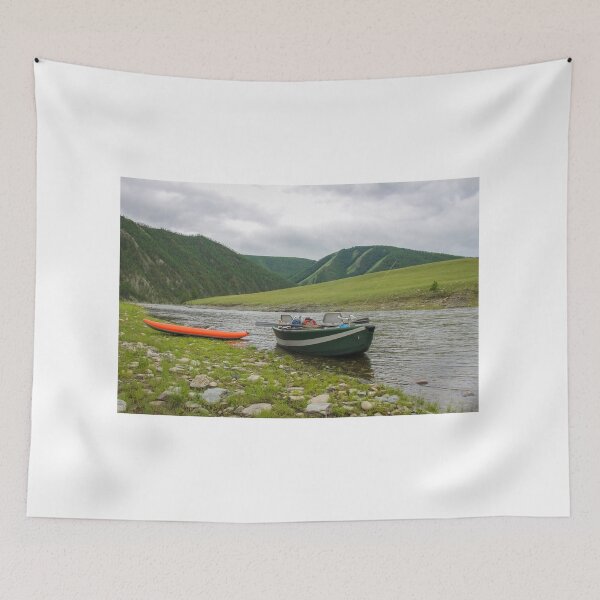 Item preview, A fishing raft and kayak anchored on grass bank beside the river designed and sold by SnapTPhotograph.