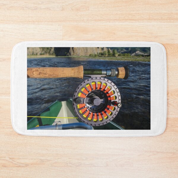Item preview, Close up of a fly fishing rod and reel in the late evening sun designed and sold by SnapTPhotograph.