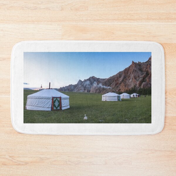 Item preview, A row of Mongolian gers at a camp at sunset on a summers night, with chimney smoke designed and sold by SnapTPhotograph.