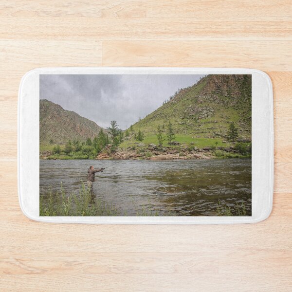 Item preview, Fly fisherman casting a fly on a river in Mongolia during the summer, designed and sold by SnapTPhotograph.