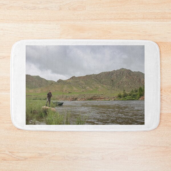 Item preview, Fly fisherman casting a fly on a river in Mongolia during the summer designed and sold by SnapTPhotograph.